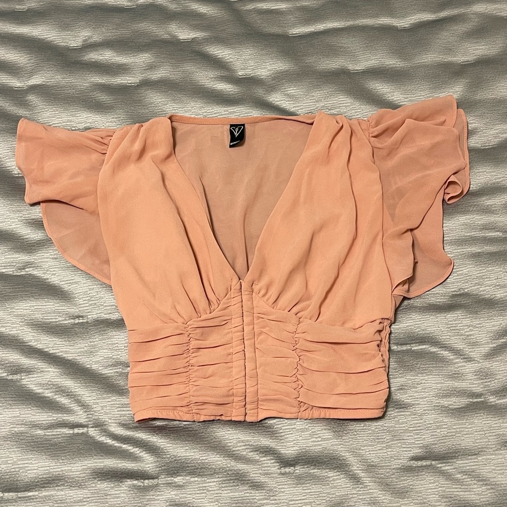 Peachy pink cropped top with ruffles